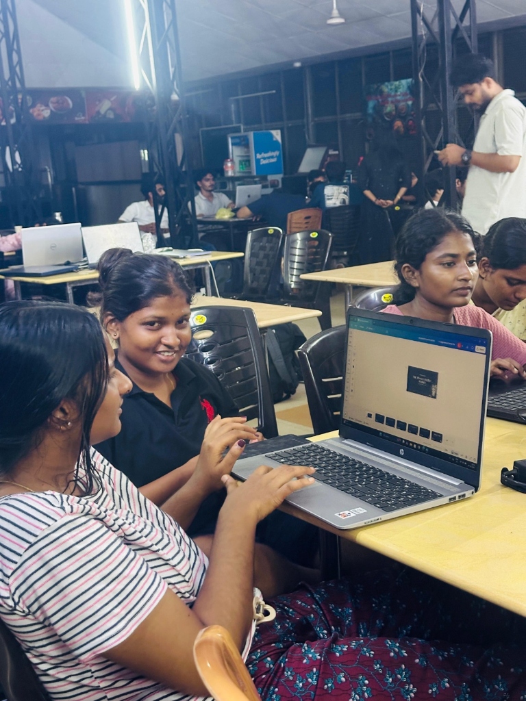Participants ideating and building their project on a laptop
